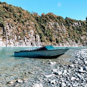 The rugged old station jet boat 'Rattler' in its home water - the Rakaia Gorge